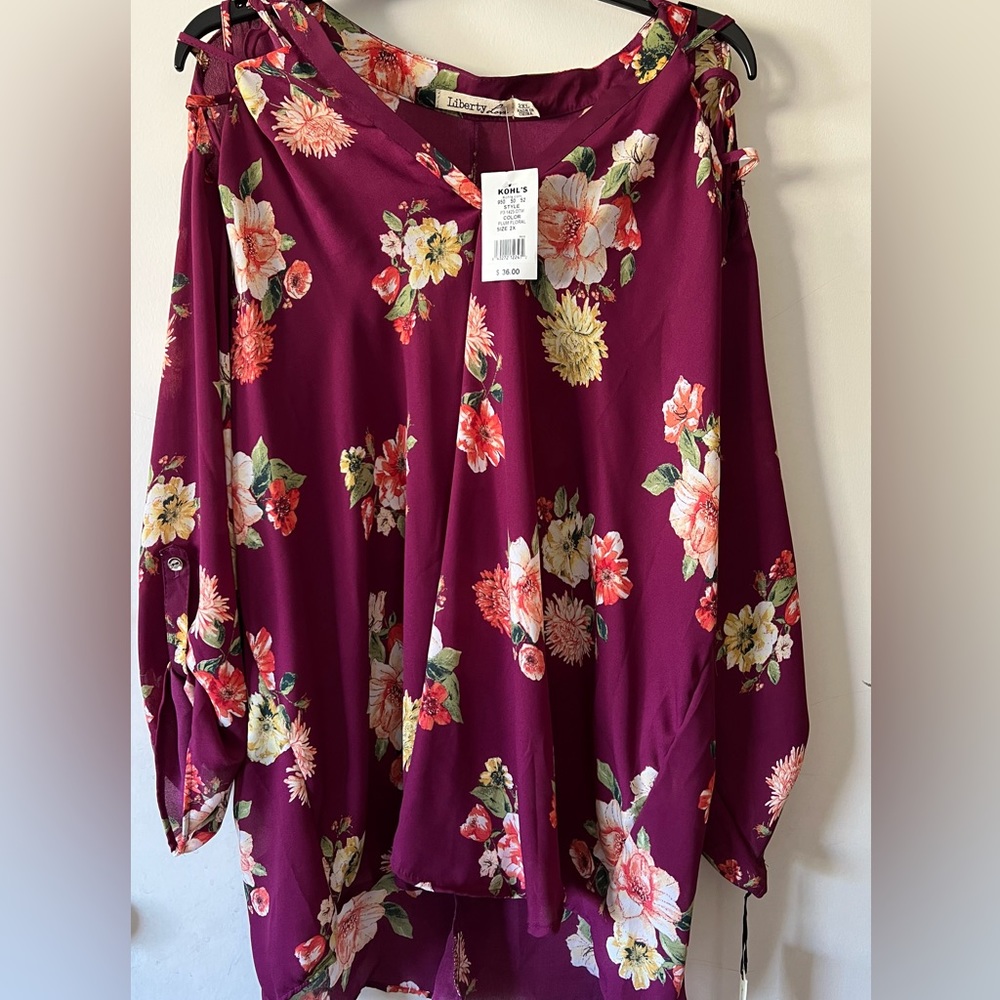 NWT Beautiful Burgundy floral top. 30 inch length by 27 inch width.